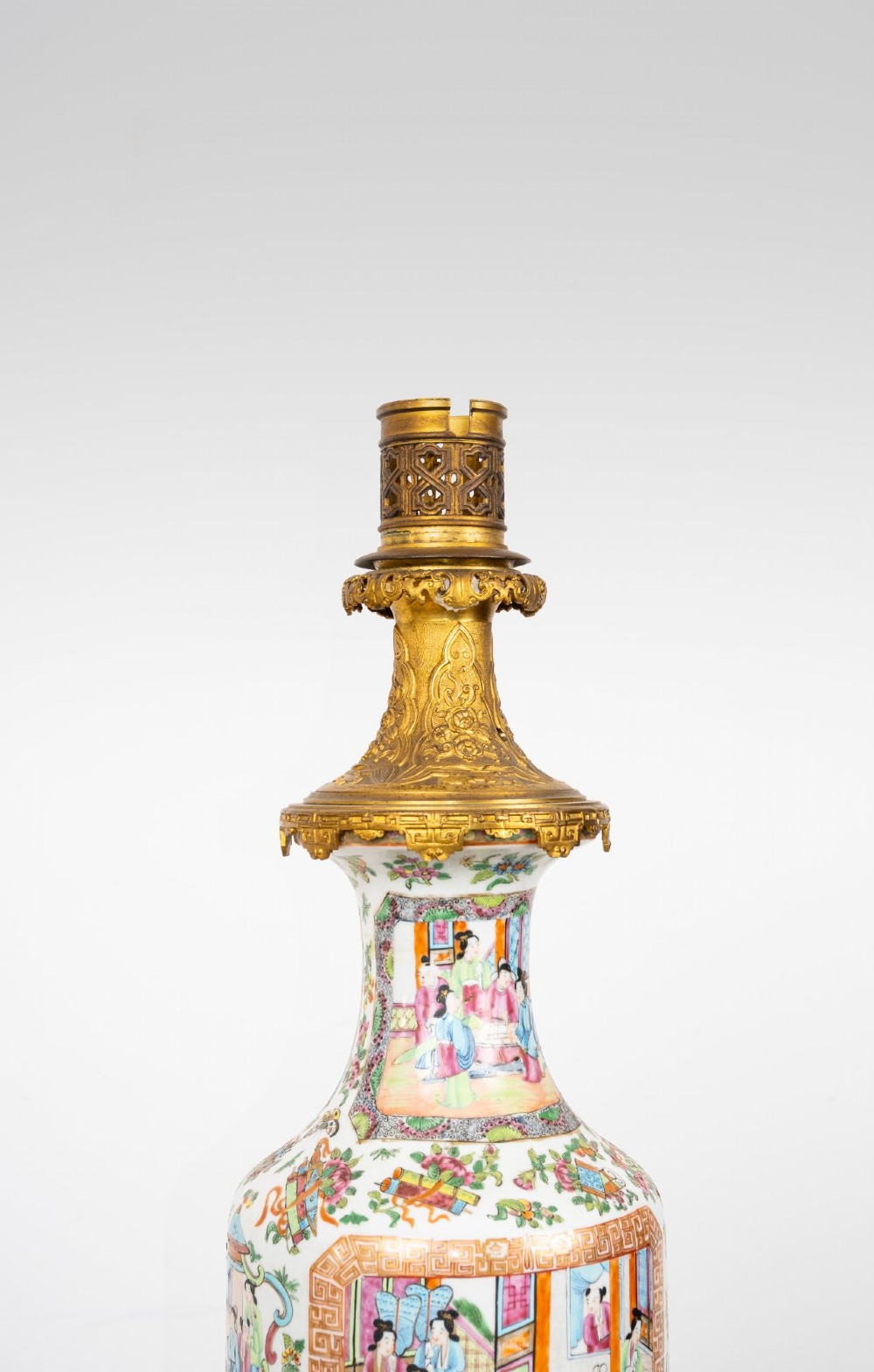 A nineteenth-century Rose Medallion porcelain vase mounted as a table lamp with an ornate gilt bronze base and collar. View VI
