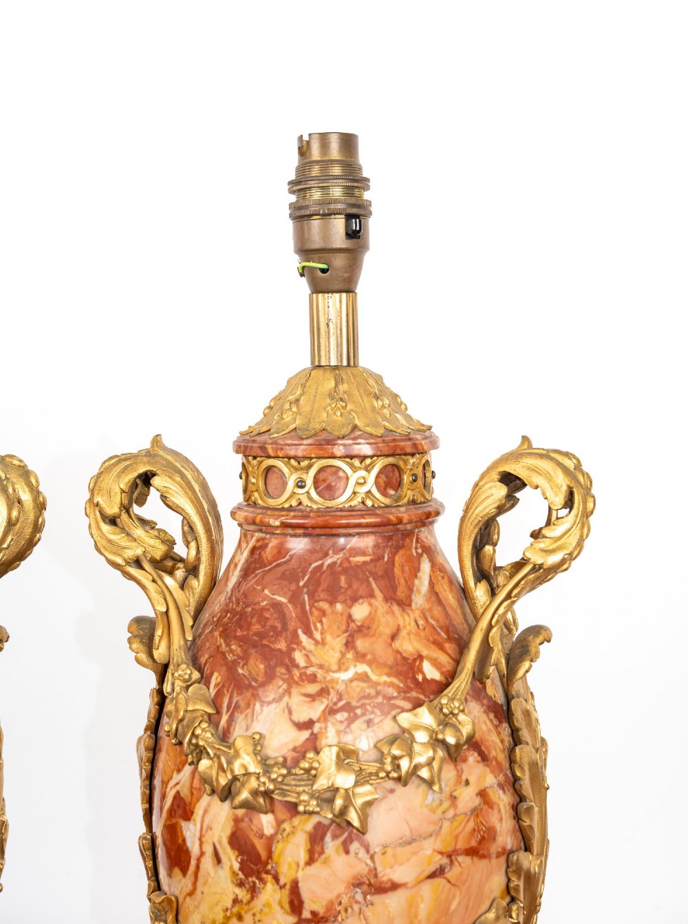 A pair of late nineteenth-century French urn-form table lamps crafted from veined red marble with gilt bronze scroll handles and floral garlands. View XII