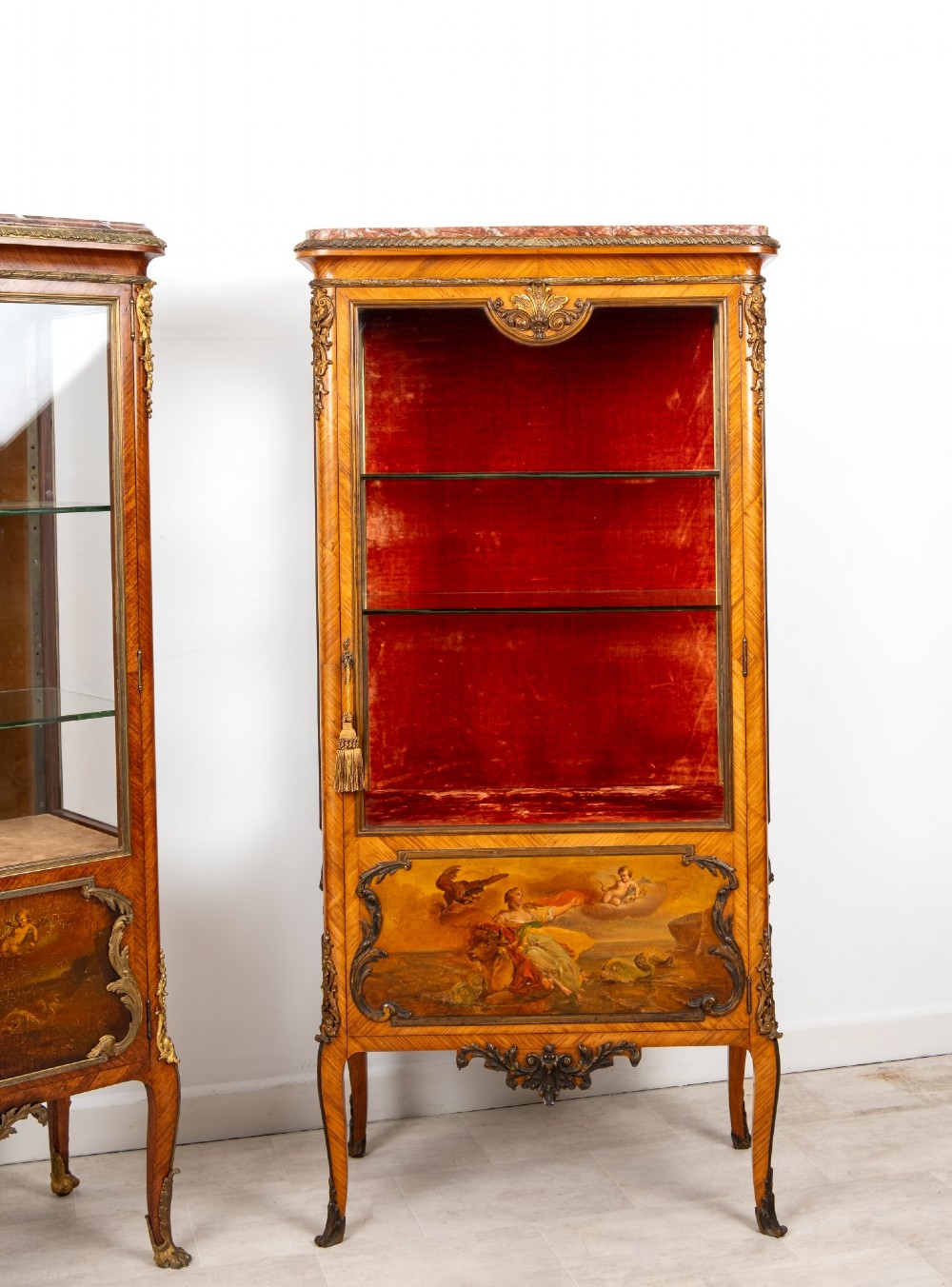 Pair of late 19th-century French kingwood vitrine cabinets featuring marble tops, glass display sections, hand-painted lower panels, and decorative gilt bronze mounts. View III