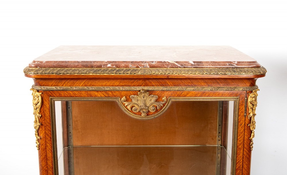 Pair of late 19th-century French kingwood vitrine cabinets featuring marble tops, glass display sections, hand-painted lower panels, and decorative gilt bronze mounts. View X