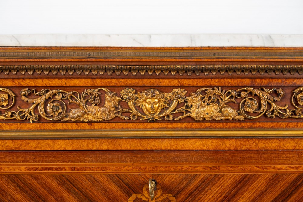 An antique nineteenth-century French parquetry secretaire a abattant writing desk featuring geometric veneer patterns, floral marquetry, gilt bronze mounts, and a marble top. View VI
