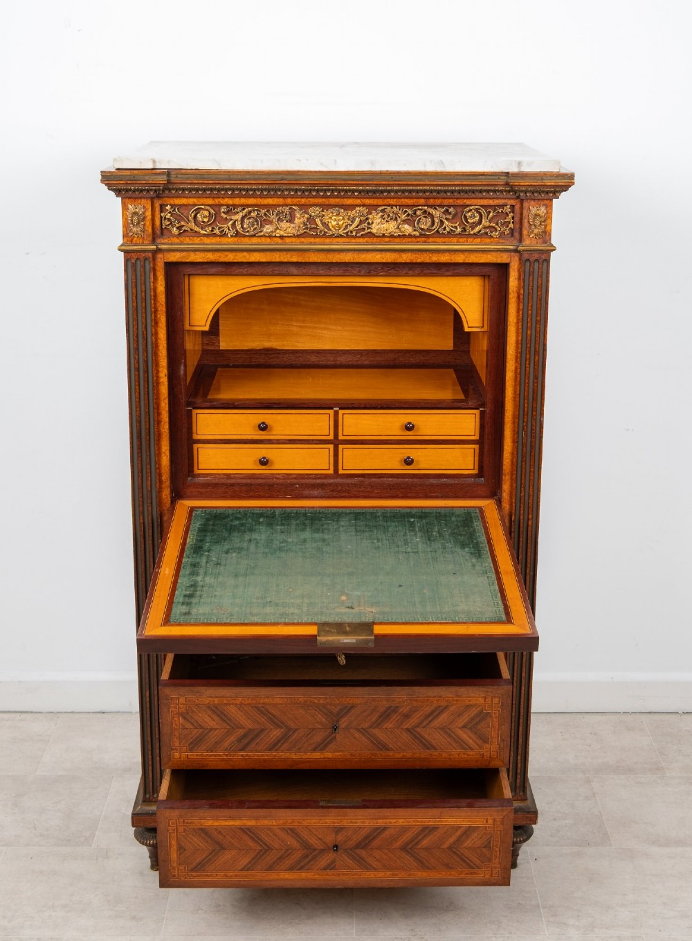 An antique nineteenth-century French parquetry secretaire a abattant writing desk featuring geometric veneer patterns, floral marquetry, gilt bronze mounts, and a marble top. View IX