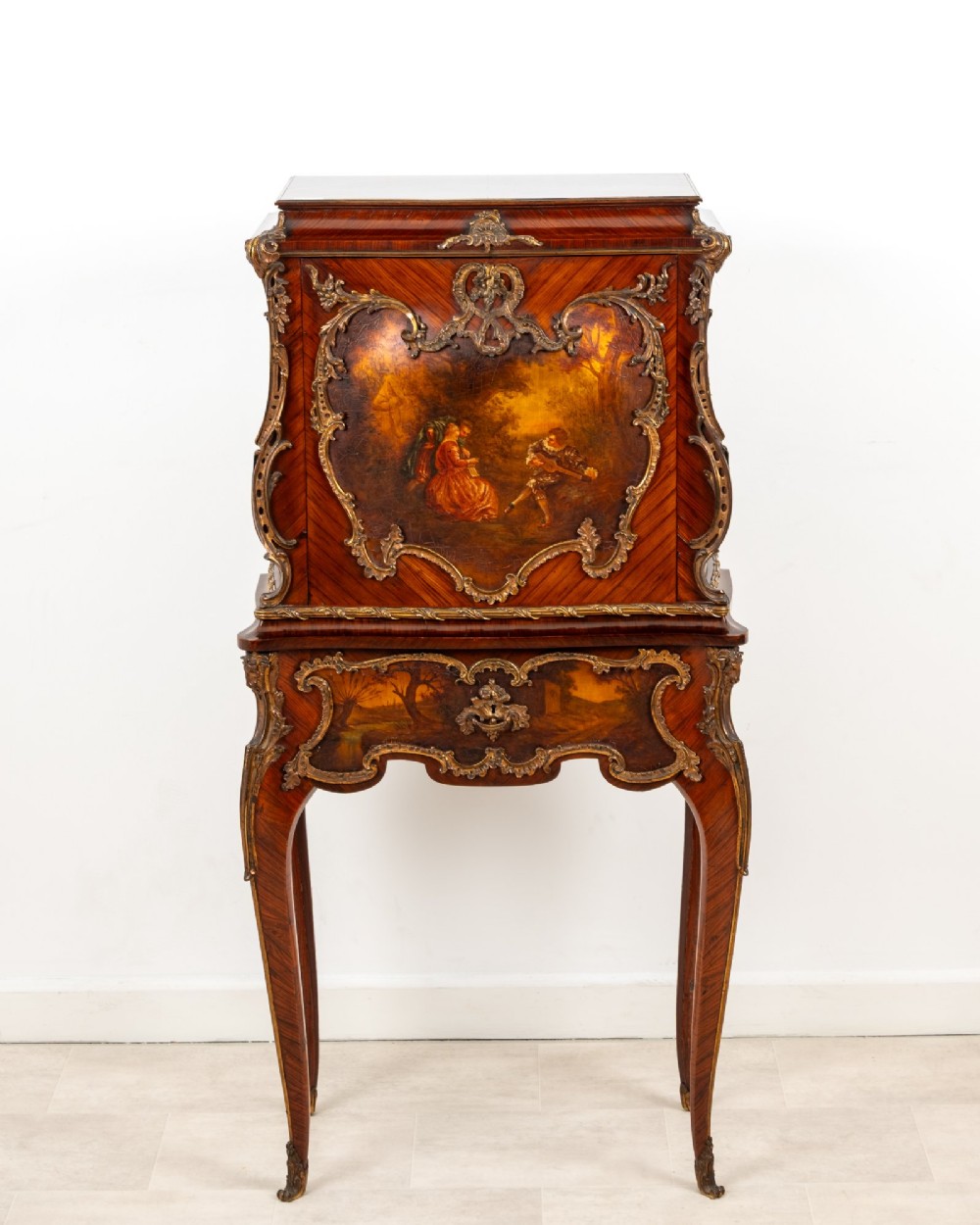 A French Louis XV style kingwood secretaire a abattant on cabriole legs, decorated with gilt bronze mounts and a hand-painted Vernis Martin scene on the fall-front flap. View II