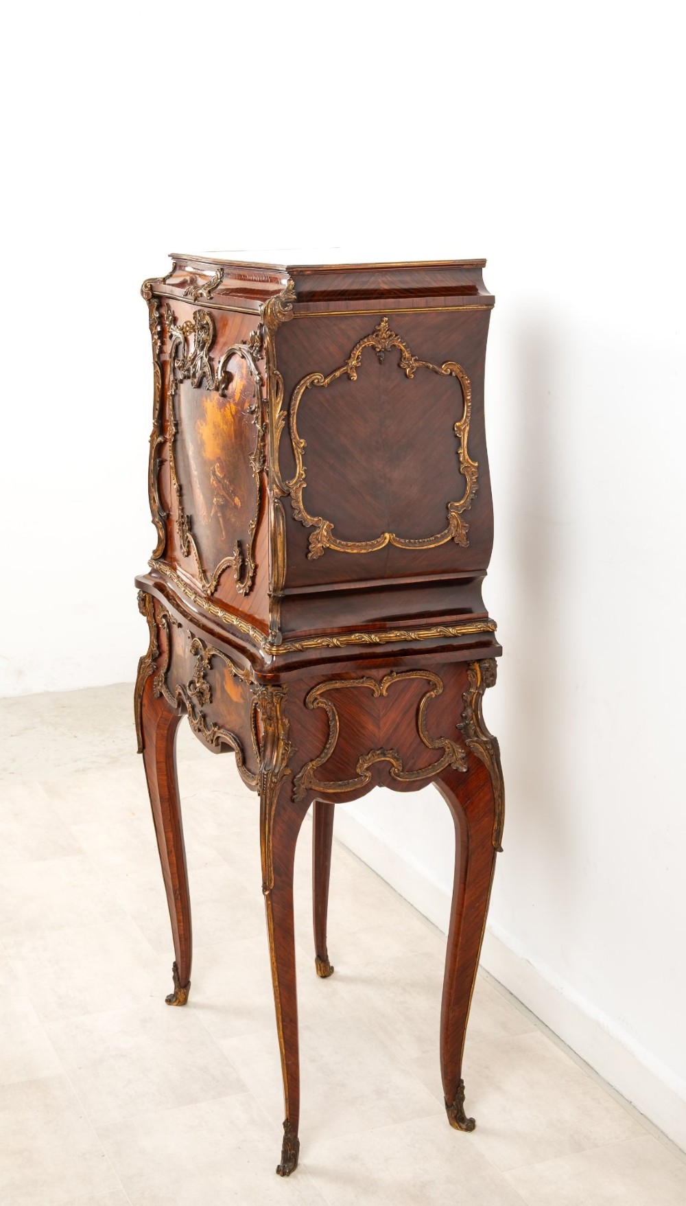 A French Louis XV style kingwood secretaire a abattant on cabriole legs, decorated with gilt bronze mounts and a hand-painted Vernis Martin scene on the fall-front flap. View VII