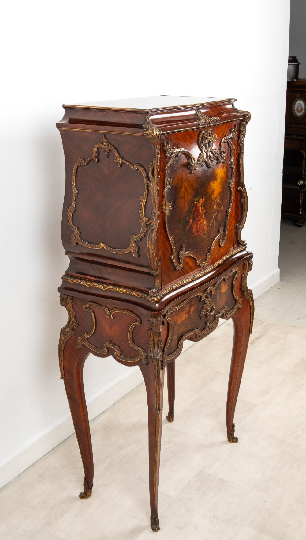 A French Louis XV style kingwood secretaire a abattant on cabriole legs, decorated with gilt bronze mounts and a hand-painted Vernis Martin scene on the fall-front flap. View VIII