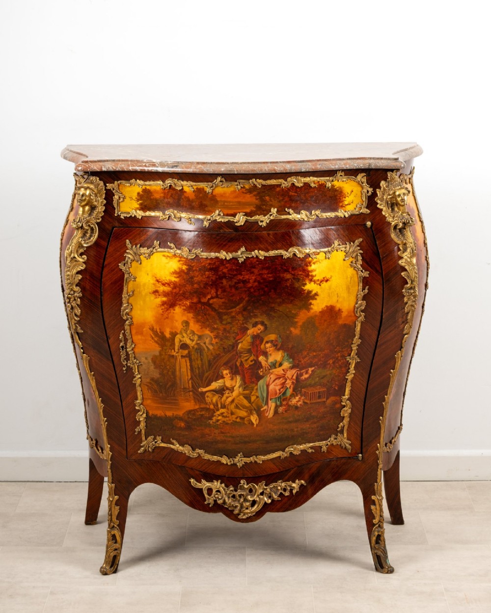 An antique French Vernis Martin bombe cabinet featuring hand-painted pastoral scenes on a curved door, ornate gilt-bronze mounts, and a marble top. View II