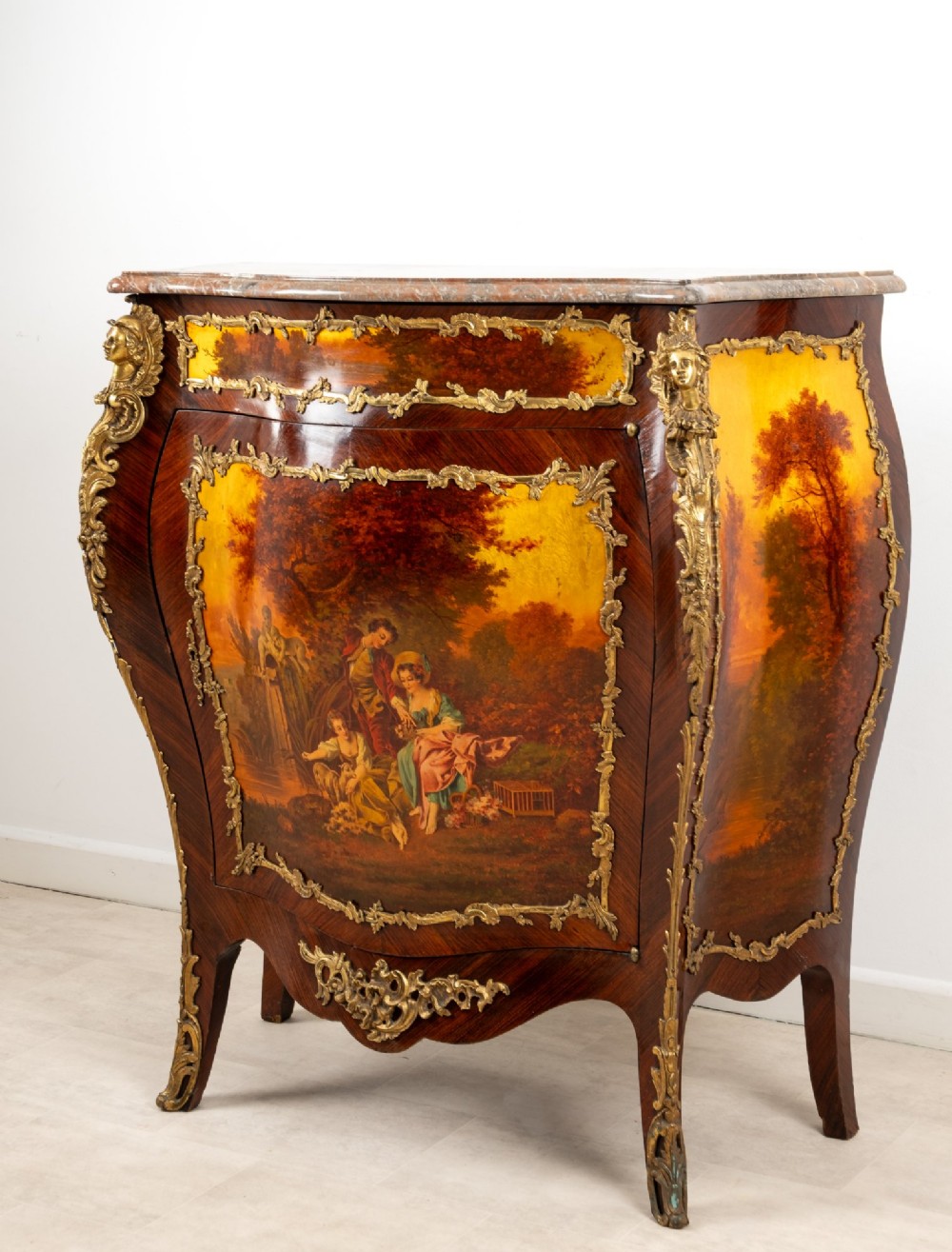 An antique French Vernis Martin bombe cabinet featuring hand-painted pastoral scenes on a curved door, ornate gilt-bronze mounts, and a marble top. View III