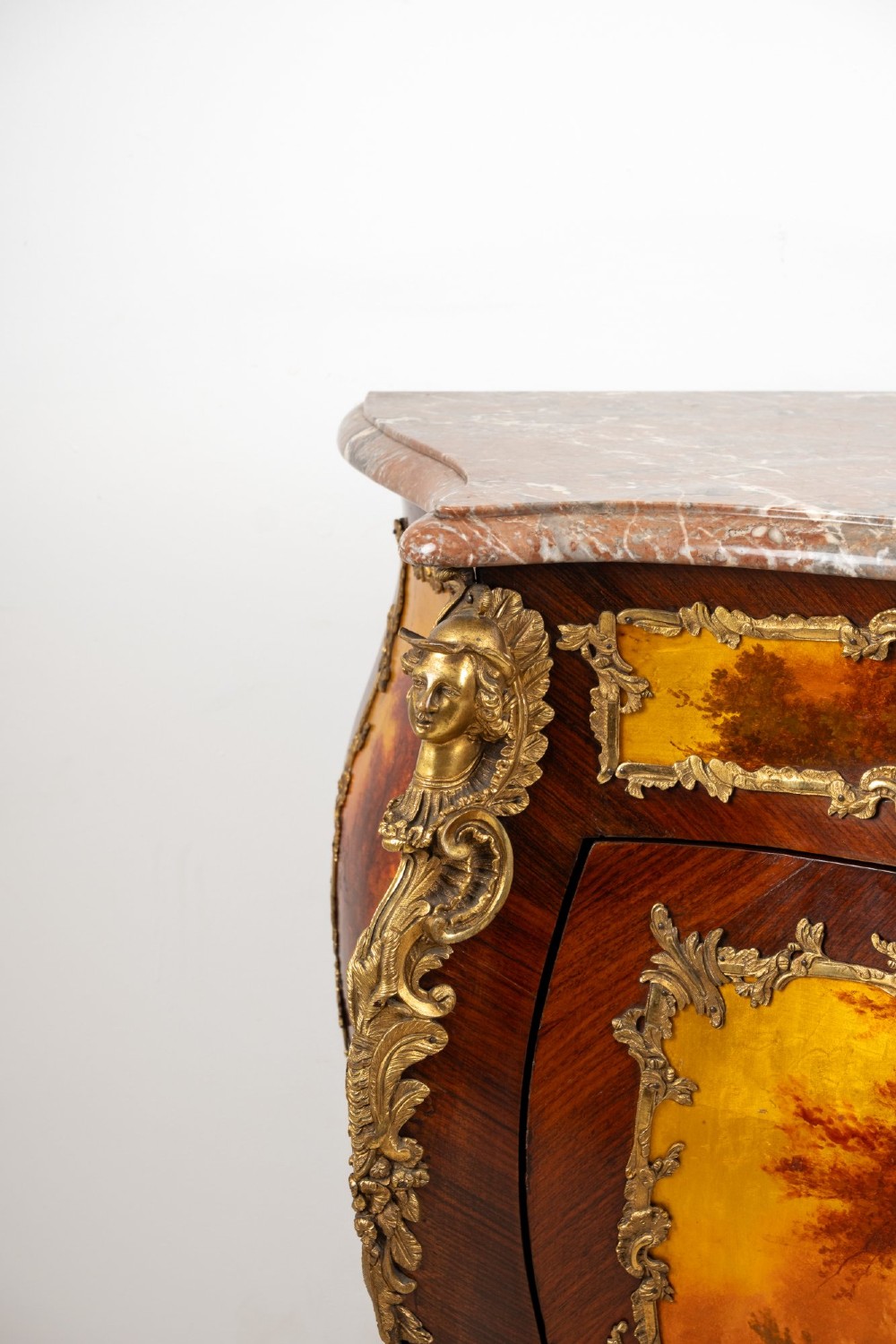 An antique French Vernis Martin bombe cabinet featuring hand-painted pastoral scenes on a curved door, ornate gilt-bronze mounts, and a marble top. View VI