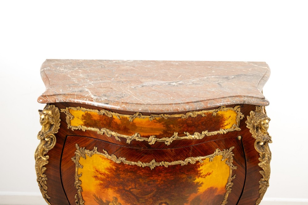 An antique French Vernis Martin bombe cabinet featuring hand-painted pastoral scenes on a curved door, ornate gilt-bronze mounts, and a marble top. View IX