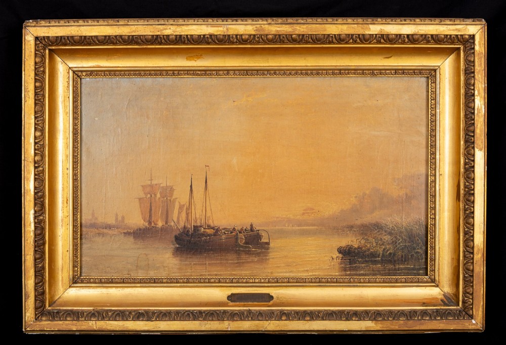 A 19th-century marine oil painting depicting sailing ships on calm water during sunset, presented in an ornate gilded wood frame.