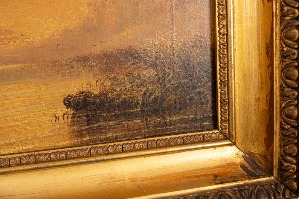 A 19th-century marine oil painting depicting sailing ships on calm water during sunset, presented in an ornate gilded wood frame. View II