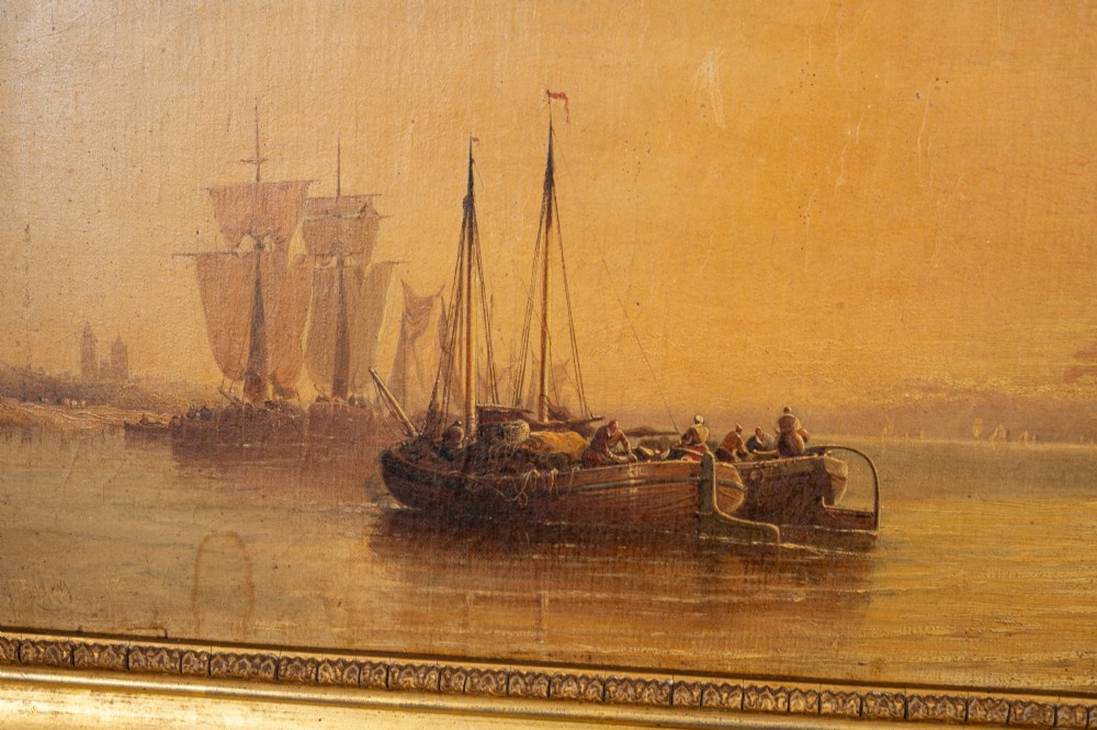 A 19th-century marine oil painting depicting sailing ships on calm water during sunset, presented in an ornate gilded wood frame. View III