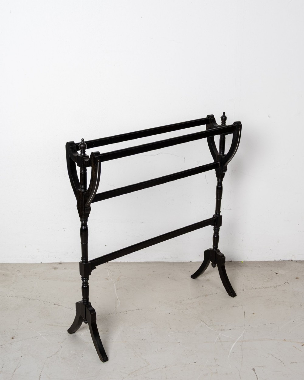 A six-piece late Victorian ebonised bedroom suite featuring bone inlay, comprising a half-tester bed, mirror wardrobe, dressing table, marble-top washstand, nightstand, and towel rail. View XIII