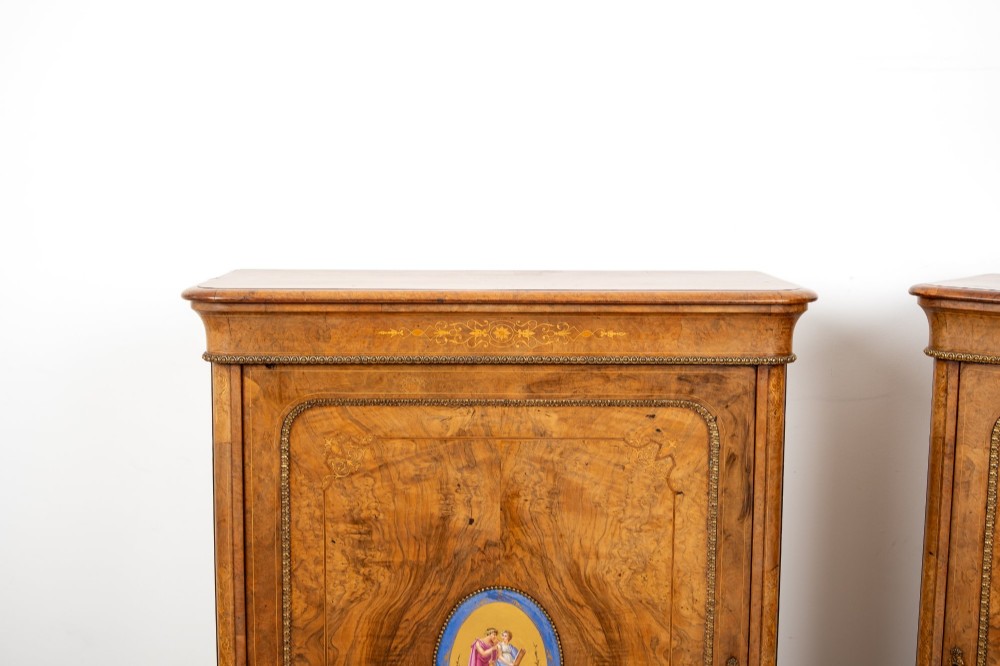 A pair of Victorian burr walnut side cabinets featuring inlaid boxwood detailing, gilt metal trim, and central oval blue porcelain plaques painted with classical figures. View V