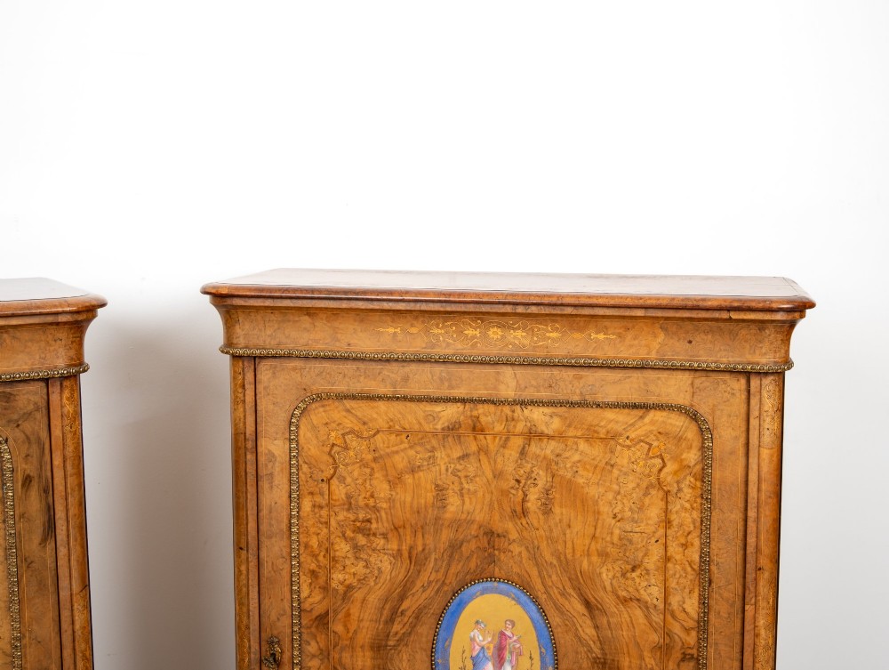 A pair of Victorian burr walnut side cabinets featuring inlaid boxwood detailing, gilt metal trim, and central oval blue porcelain plaques painted with classical figures. View VI