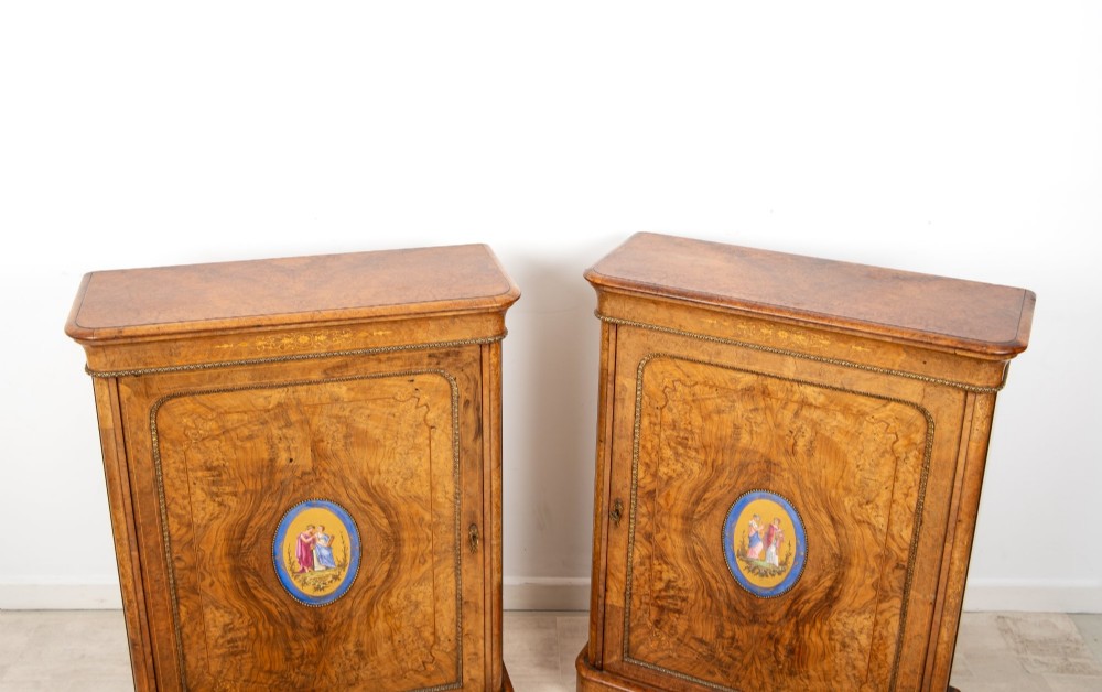 A pair of Victorian burr walnut side cabinets featuring inlaid boxwood detailing, gilt metal trim, and central oval blue porcelain plaques painted with classical figures. View VII