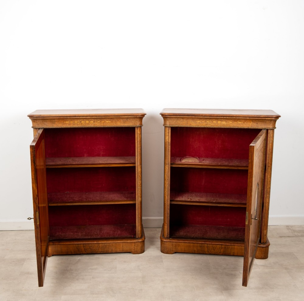 A pair of Victorian burr walnut side cabinets featuring inlaid boxwood detailing, gilt metal trim, and central oval blue porcelain plaques painted with classical figures. View X