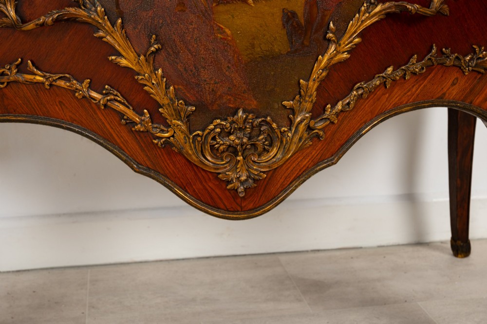 A French Louis XV revival bombee commode in kingwood with gilt-bronze mounts, a central hand-painted Vernis Martin scene, and a marble top. View VIII