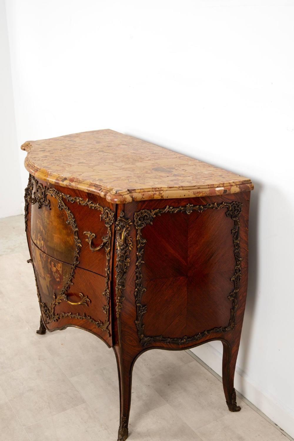 A French Louis XV revival bombee commode in kingwood with gilt-bronze mounts, a central hand-painted Vernis Martin scene, and a marble top. View X