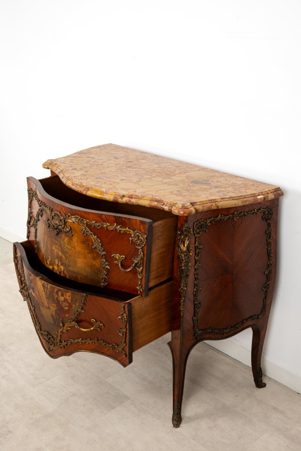 A French Louis XV revival bombee commode in kingwood with gilt-bronze mounts, a central hand-painted Vernis Martin scene, and a marble top. View XI