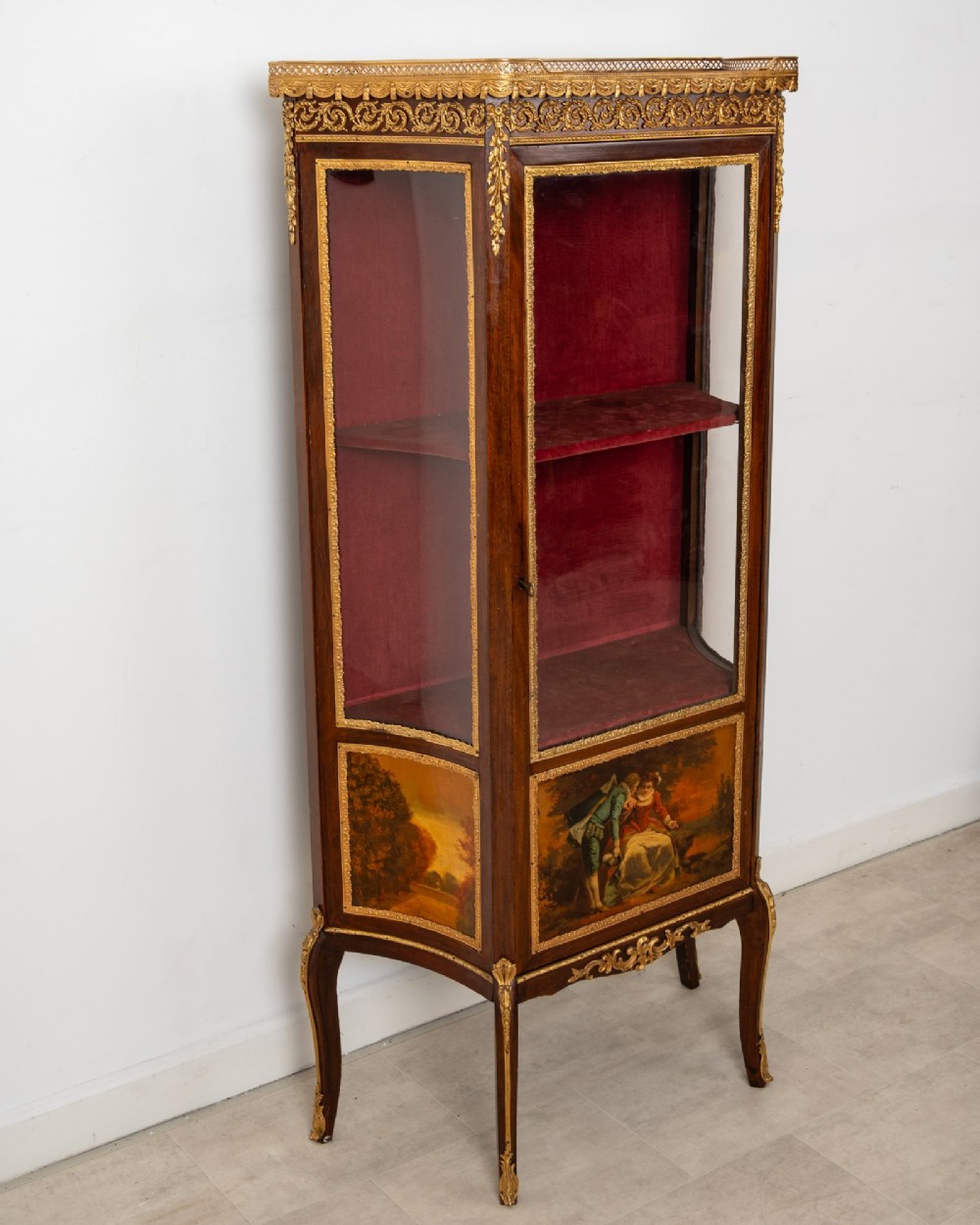 An antique French mahogany vitrine display cabinet featuring hand-painted Vernis Martin panels, gilt bronze mounts, cabriole legs, and a red velvet interior. View IV