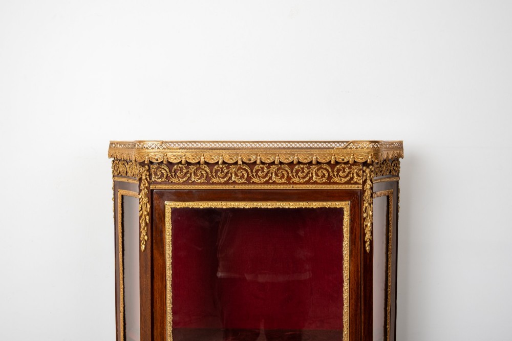 An antique French mahogany vitrine display cabinet featuring hand-painted Vernis Martin panels, gilt bronze mounts, cabriole legs, and a red velvet interior. View V