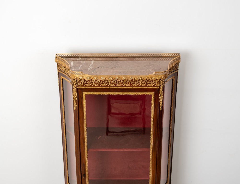 An antique French mahogany vitrine display cabinet featuring hand-painted Vernis Martin panels, gilt bronze mounts, cabriole legs, and a red velvet interior. View VI