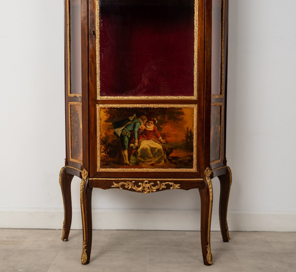 An antique French mahogany vitrine display cabinet featuring hand-painted Vernis Martin panels, gilt bronze mounts, cabriole legs, and a red velvet interior. View VII