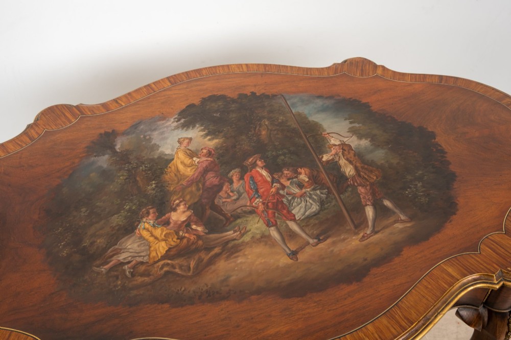 A French Louis XV style centre table featuring a serpentine glass-covered top with a painted figurative scene, cabriole legs, and ornate gilt bronze mounts. View VI