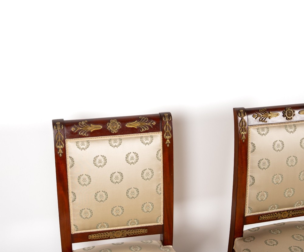 A three-piece antique French Empire Revival salon suite comprising a mahogany two-seater settee and two matching side chairs with gold silk laurel wreath upholstery and ormolu mounts. View IX