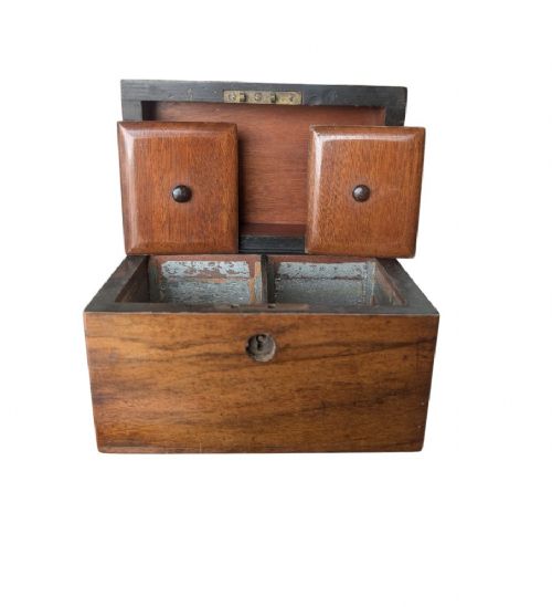 A nineteenth-century dark brown wooden tea caddy featuring a domed lid and a central keyhole. View VI