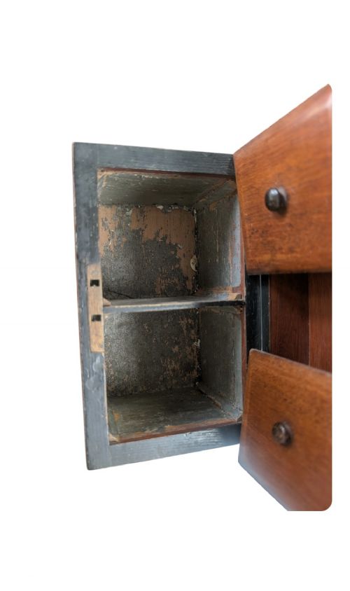 A nineteenth-century dark brown wooden tea caddy featuring a domed lid and a central keyhole. View VII