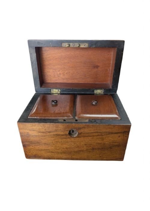 A nineteenth-century dark brown wooden tea caddy featuring a domed lid and a central keyhole. View VIII