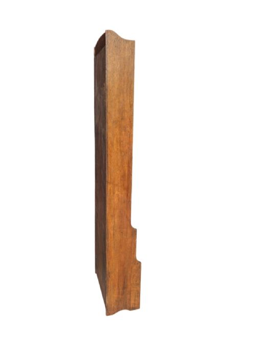 A tall, narrow warm brown oak open bookcase featuring graduated waterfall sides and seven tiers of shelving. View II