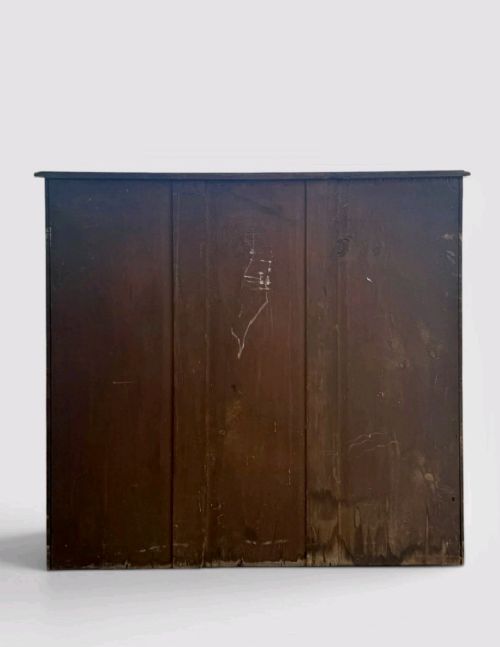 A Victorian pine chest of drawers featuring two short drawers over three long drawers with turned wooden knobs and keyholes. View VIII