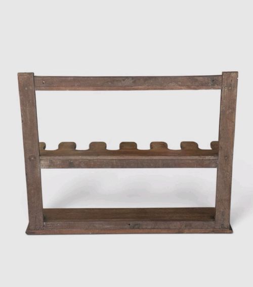 An antique Victorian mahogany boot rack featuring two tiered notched rails designed to hold footwear above a flat rectangular wooden base. View IV