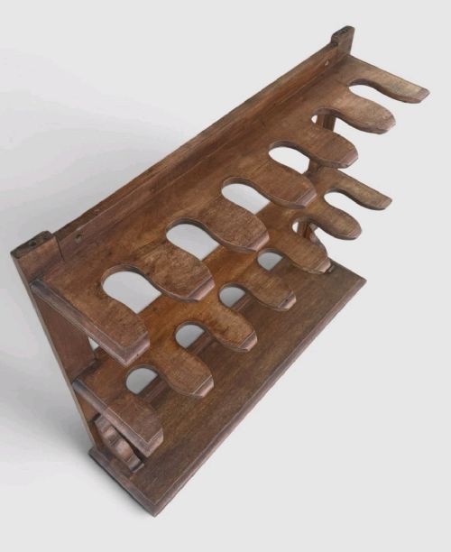 An antique Victorian mahogany boot rack featuring two tiered notched rails designed to hold footwear above a flat rectangular wooden base. View VI
