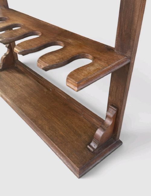An antique Victorian mahogany boot rack featuring two tiered notched rails designed to hold footwear above a flat rectangular wooden base. View IX