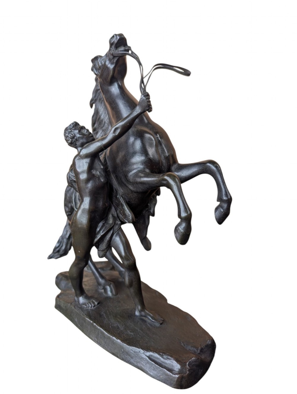 A pair of dark bronze sculptures depicting rearing horses restrained by standing grooms on naturalistic rock bases. View V