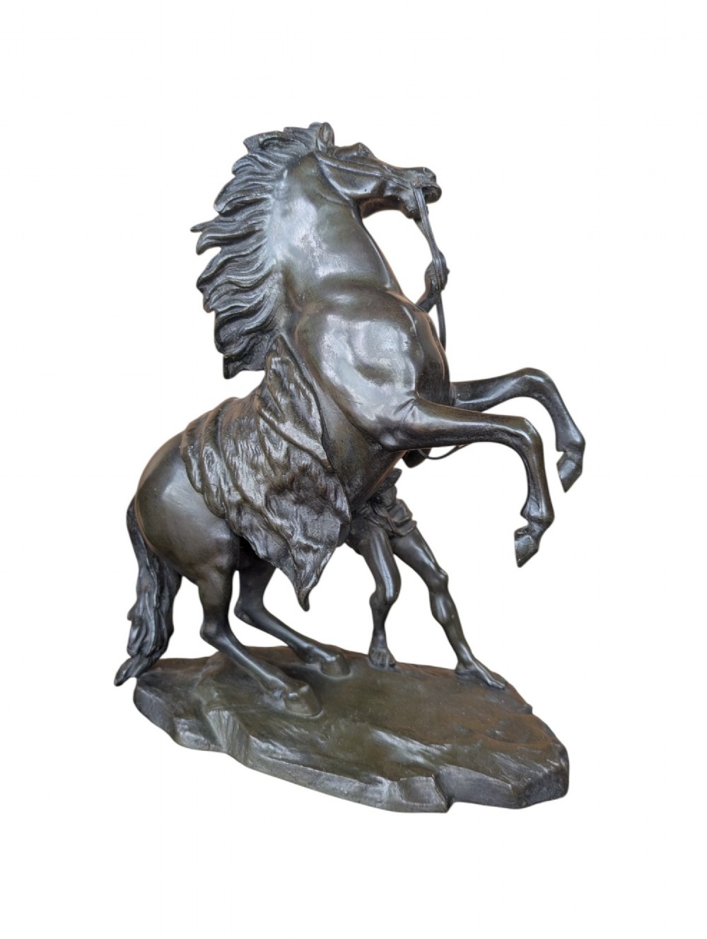 A pair of dark bronze sculptures depicting rearing horses restrained by standing grooms on naturalistic rock bases. View VII