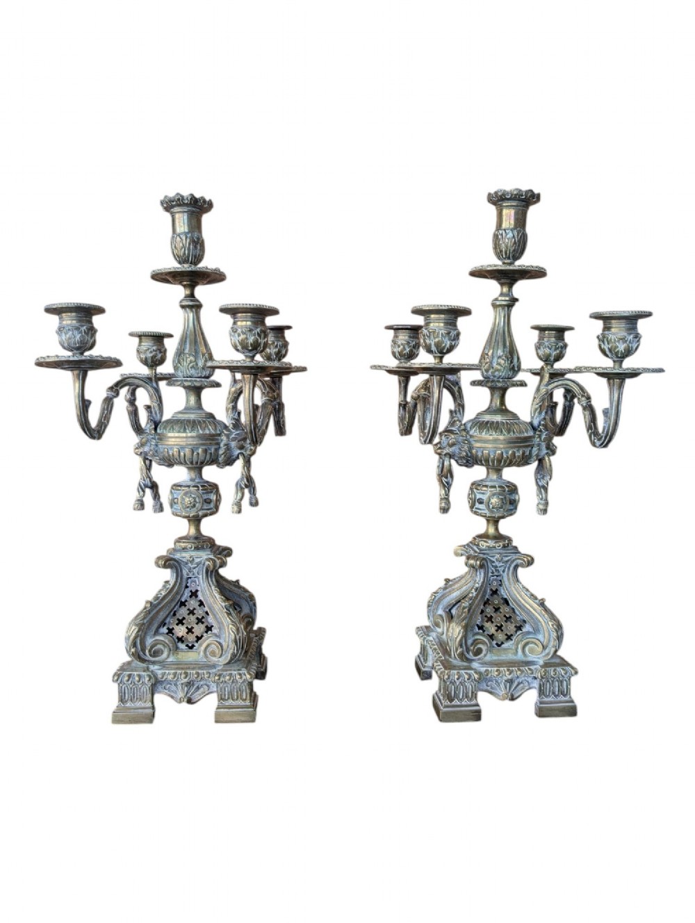 A matching pair of ornate late 19th-century patinated bronze five-light candelabra featuring lion mask motifs, scrollwork arms, and pierced decorative bases. View III