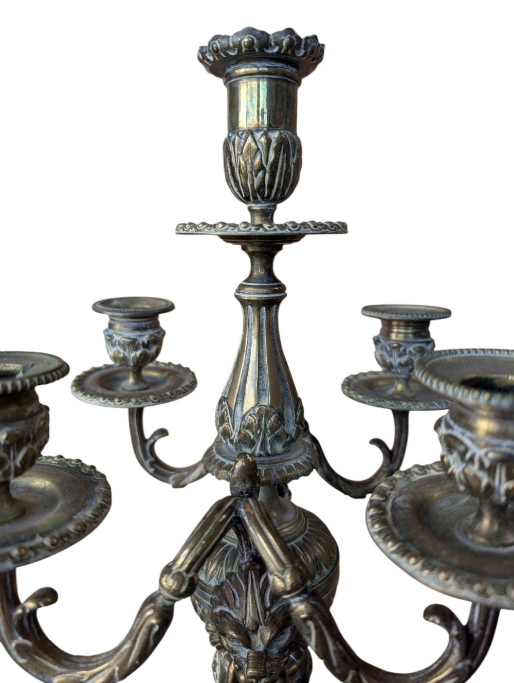 A matching pair of ornate late 19th-century patinated bronze five-light candelabra featuring lion mask motifs, scrollwork arms, and pierced decorative bases. View VII