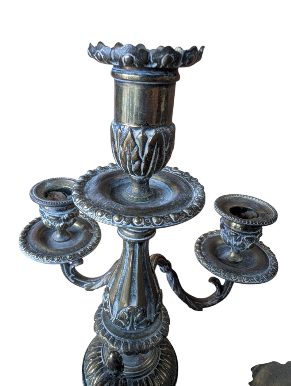 A matching pair of ornate late 19th-century patinated bronze five-light candelabra featuring lion mask motifs, scrollwork arms, and pierced decorative bases. View X