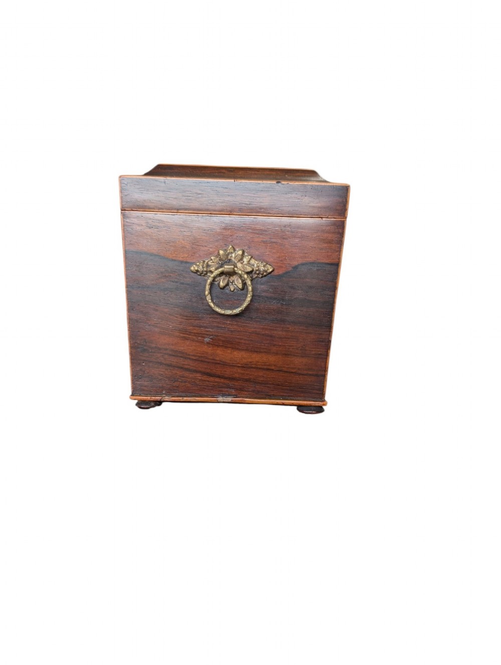 A rectangular Regency period wooden tea caddy featuring dark wood grain, mosaic inlay borders, and a central diamond escutcheon. View II