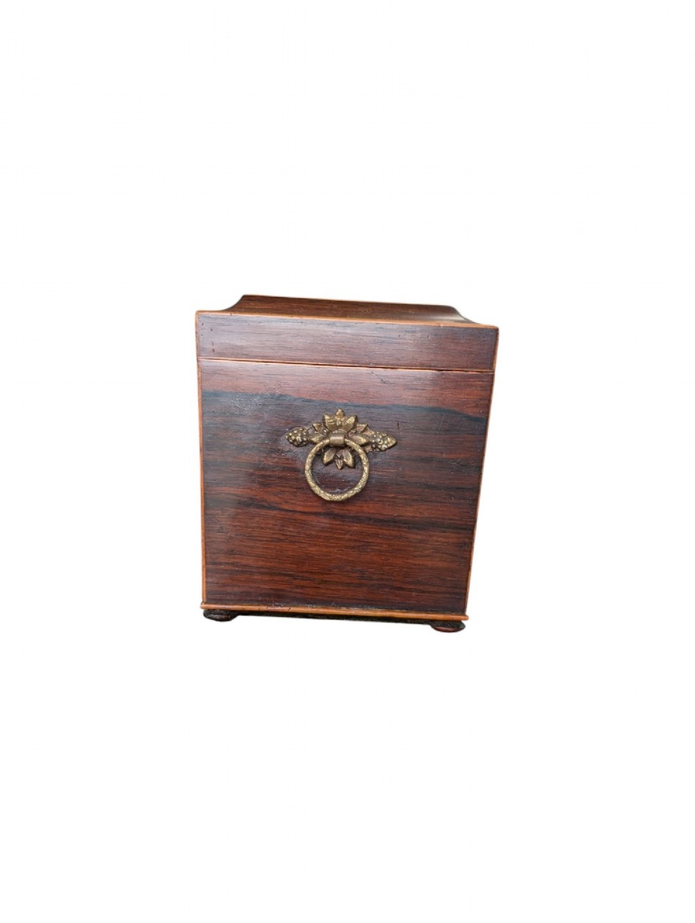 A rectangular Regency period wooden tea caddy featuring dark wood grain, mosaic inlay borders, and a central diamond escutcheon. View IV