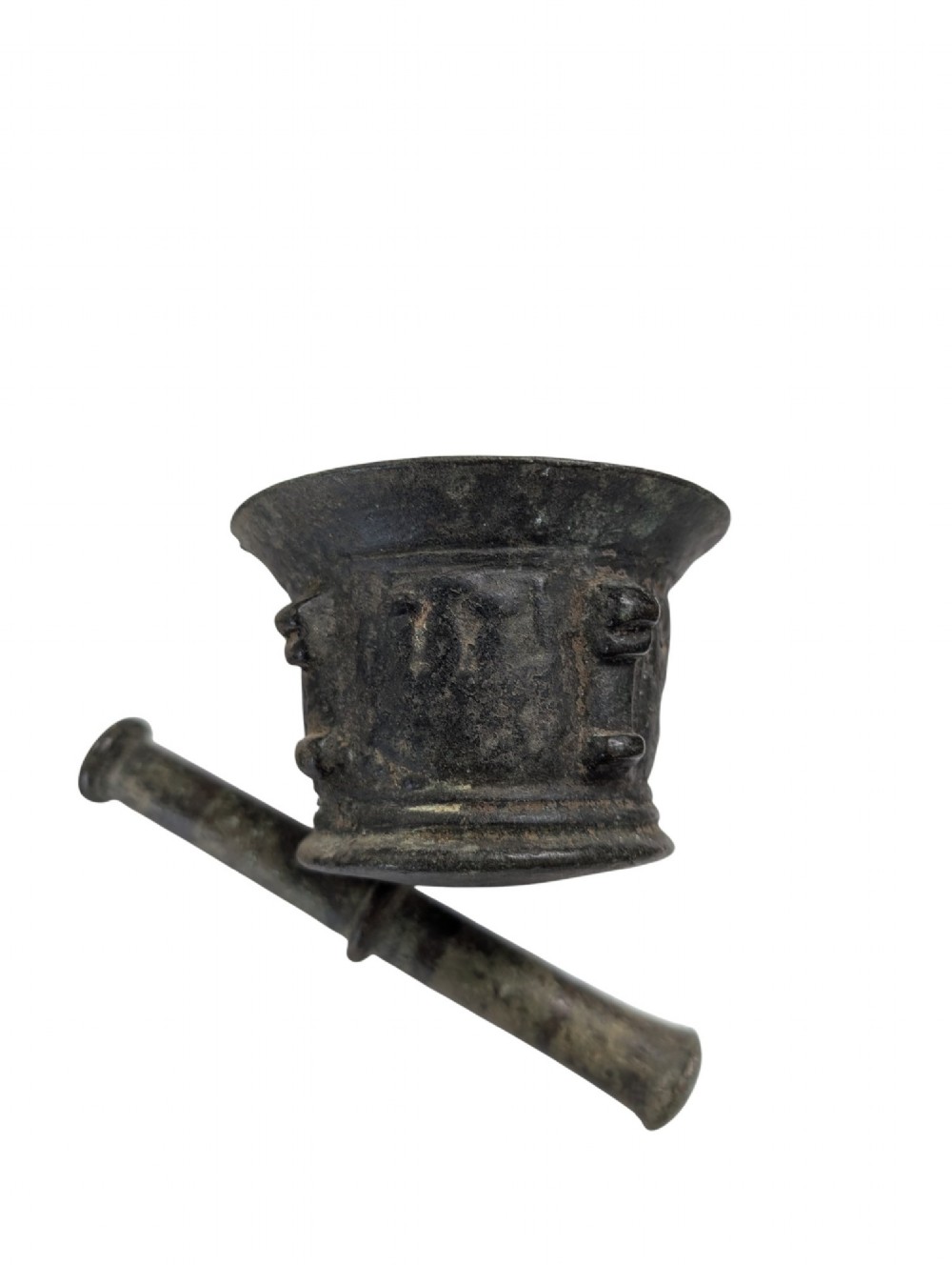 An antique cast bronze mortar and pestle displaying an aged surface patina with a flared rim and turned central ridge. View III