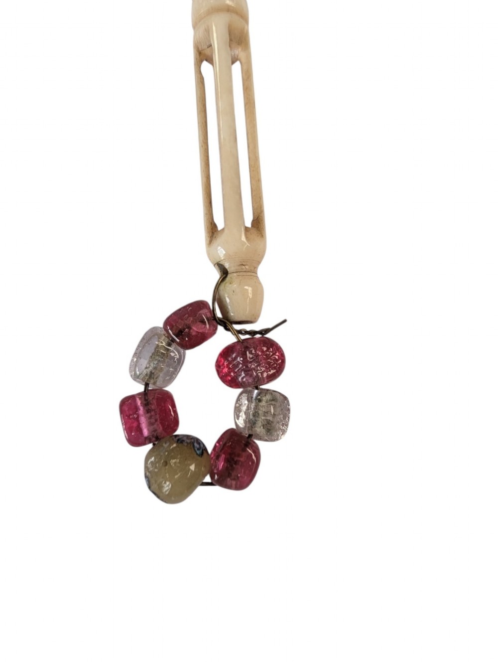 Three turned antique lace bobbins crafted from bone and wood, each featuring decorative wire-bound glass bead spangles. View III