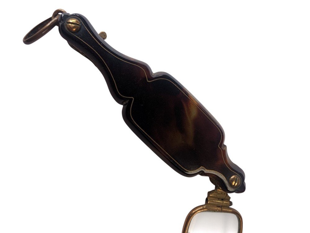 A French antique folding lorgnette with a faux tortoiseshell protective case and brass-framed rectangular lenses extended. View III