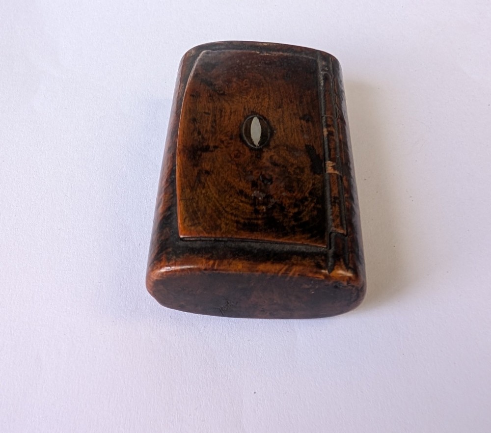 A 19th-century rectangular dark burr wood snuff box with an oval centre inlay and integrated wooden hinges. View IV