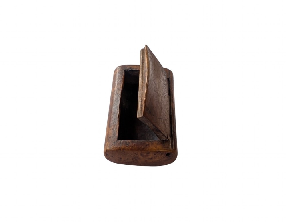 A small rectangular 19th-century carved wooden snuff box featuring an integral wooden hinge and a central oval wood inlay. View IV